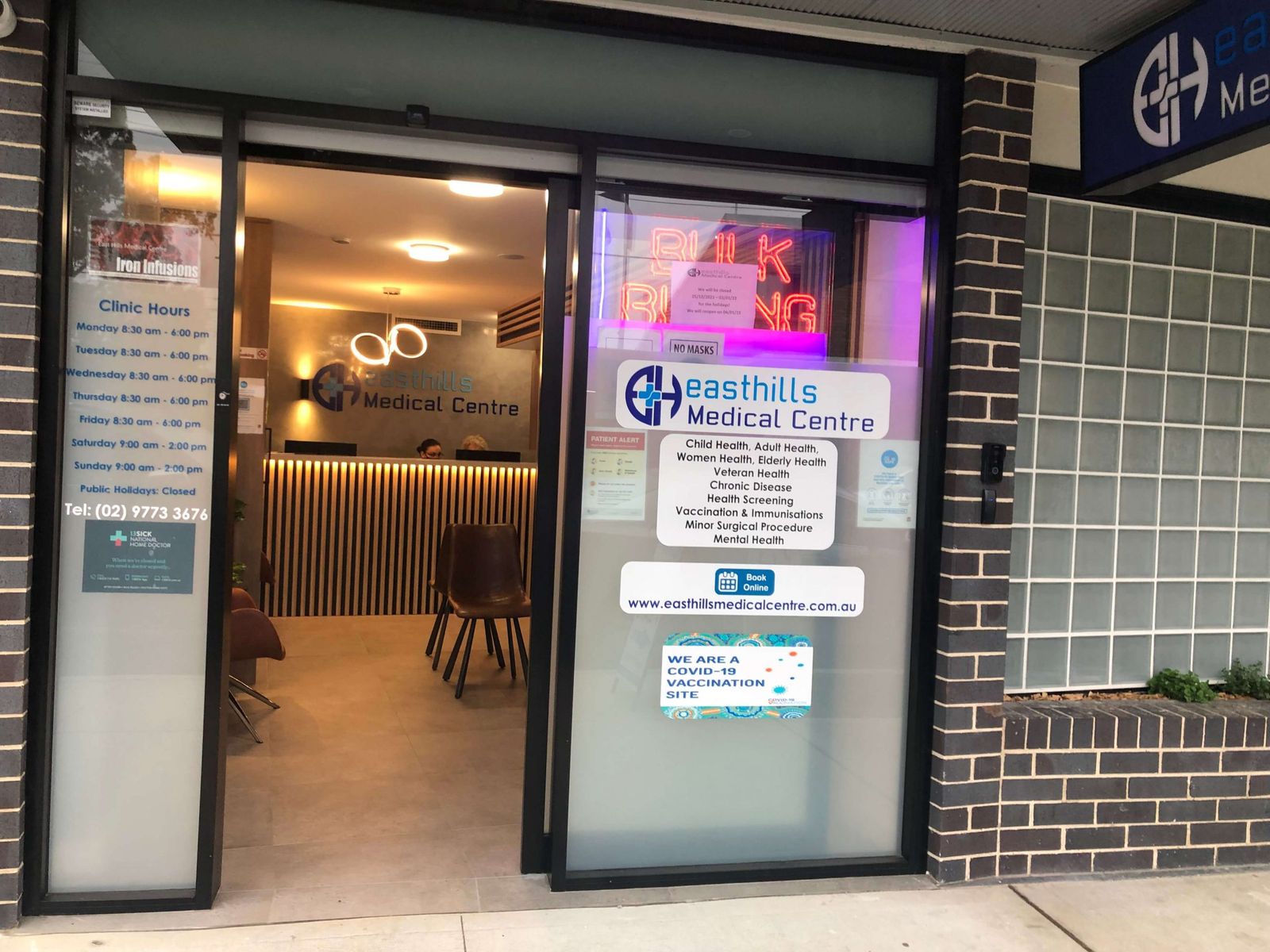 Entrance of East Hills Medical Centre on Maclaurin Avenue with the practice sign above the door